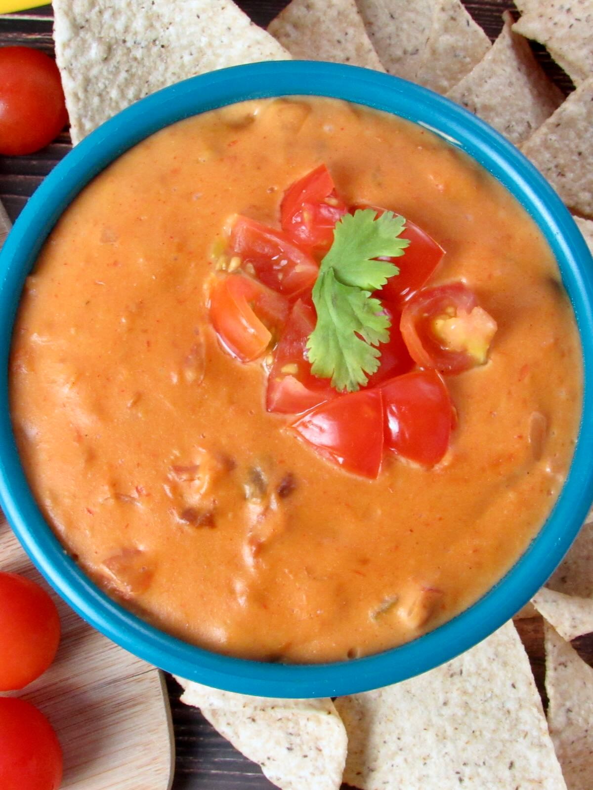 Dairy Free Nacho Cheese with cilantro and tomato.