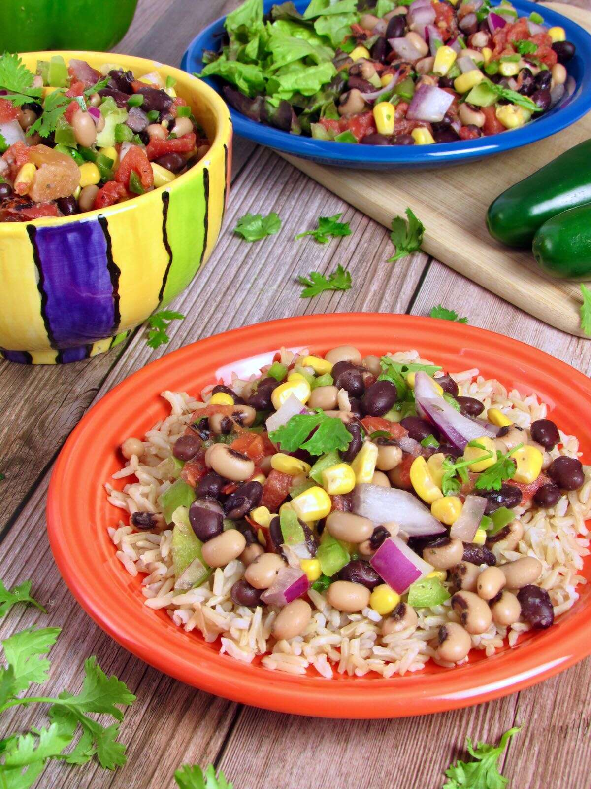 Cowboy Caviar Bean Salad, served with rice and fresh veggies.