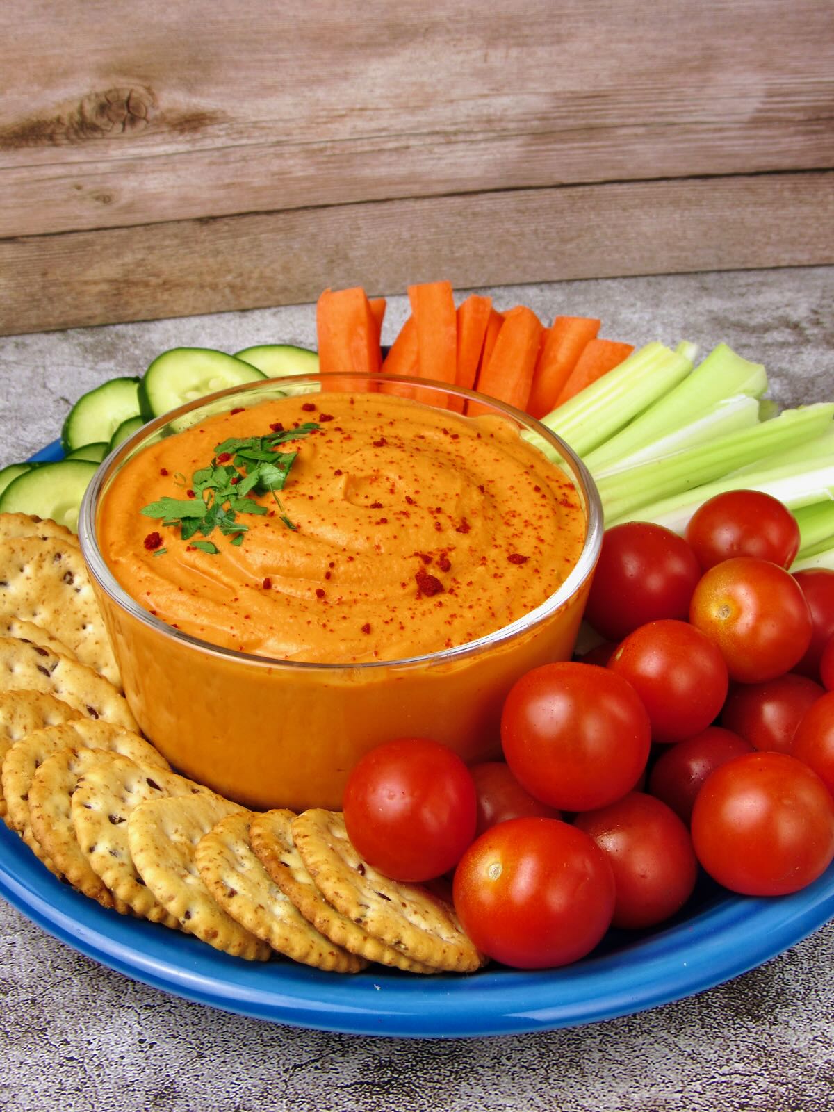 Red Pepper Hummus platter with fresh vegetables.