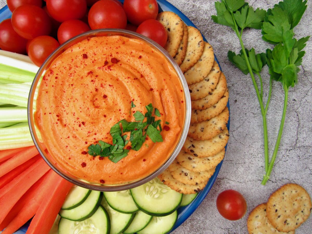 Roasted Red Pepper Hummus with fresh veggies and crackers.