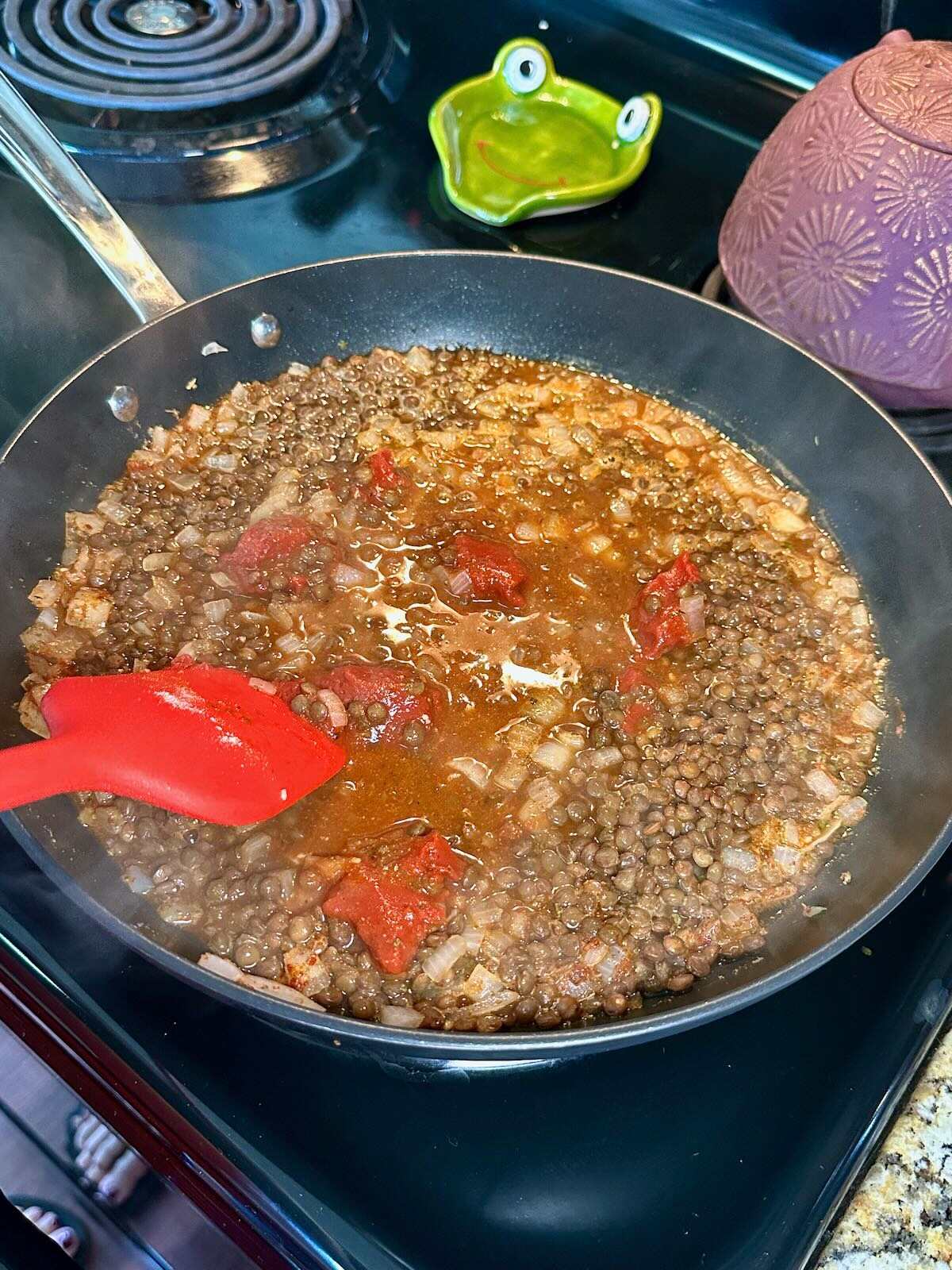 Cooking lentils with veggie broth and Tex Mex seasonings.