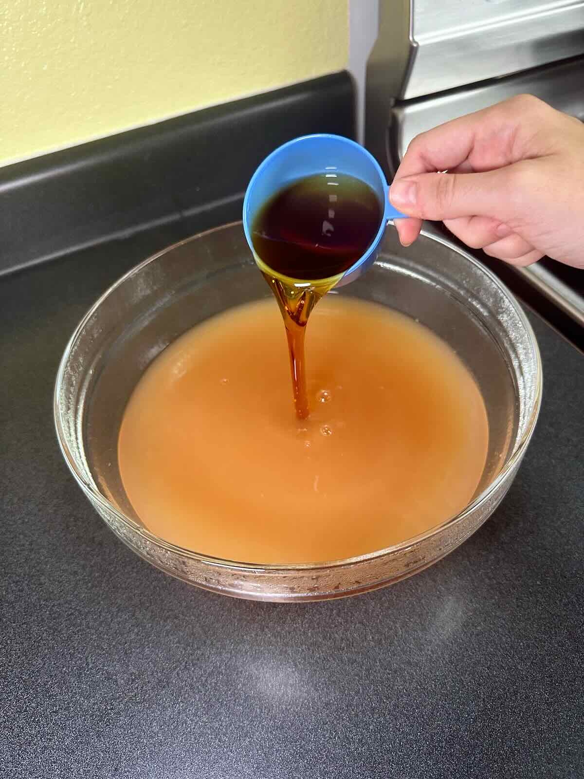 Adding maple syrup as sweetener to Easy Homemade Apple Cider.
