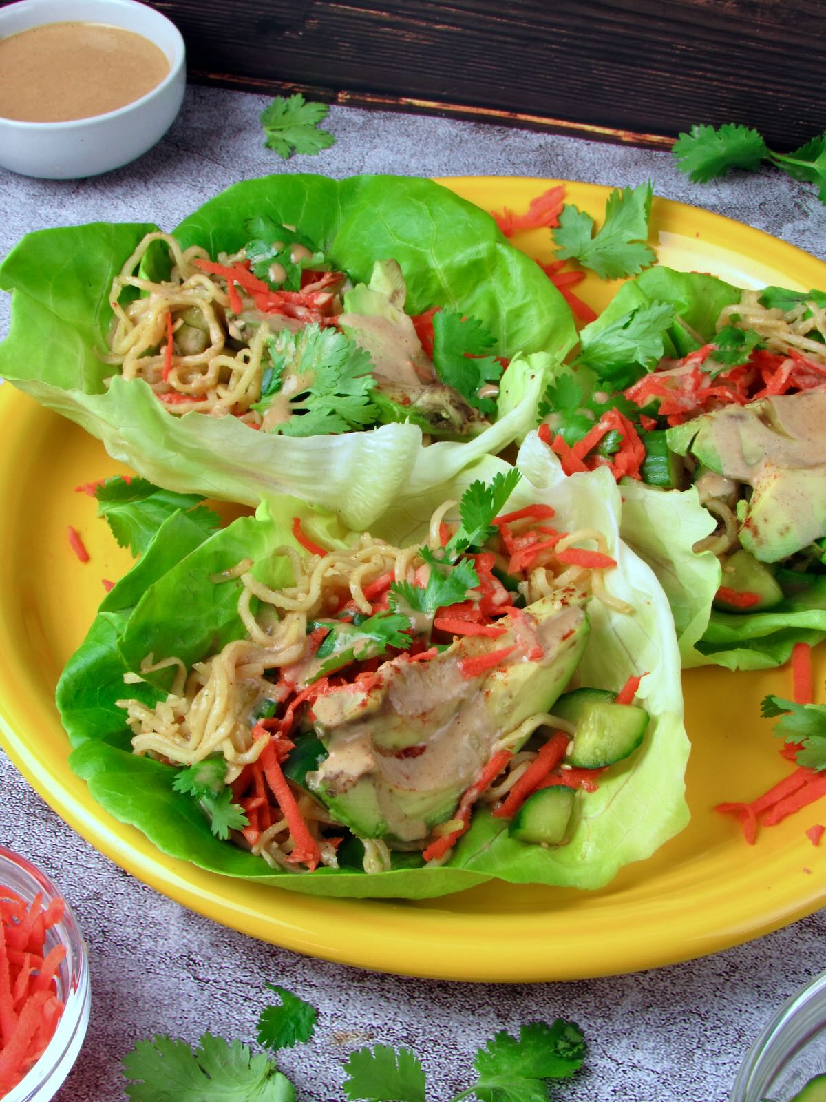 Vegan Thai Lettuce Wraps with Grilled Avocado and fresh veggies.