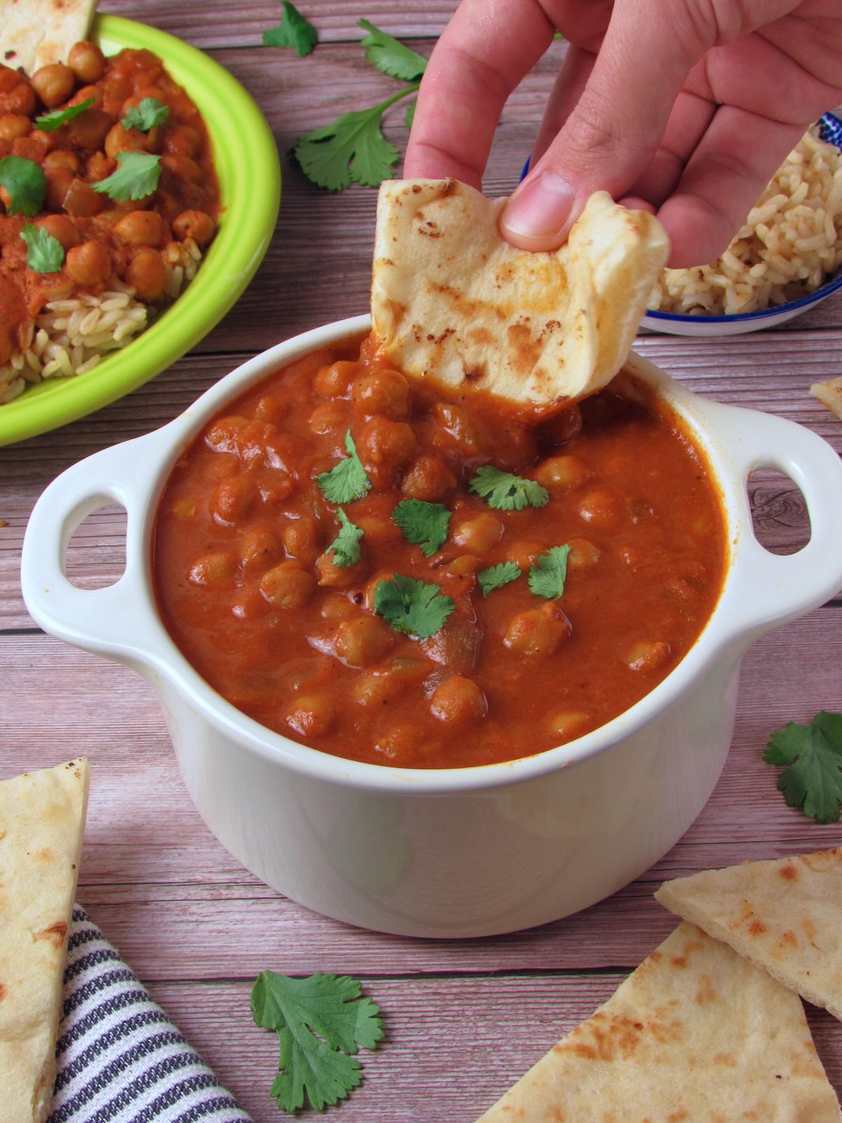 Vegan Chickpea Tikka Masala curry with plant based naan.