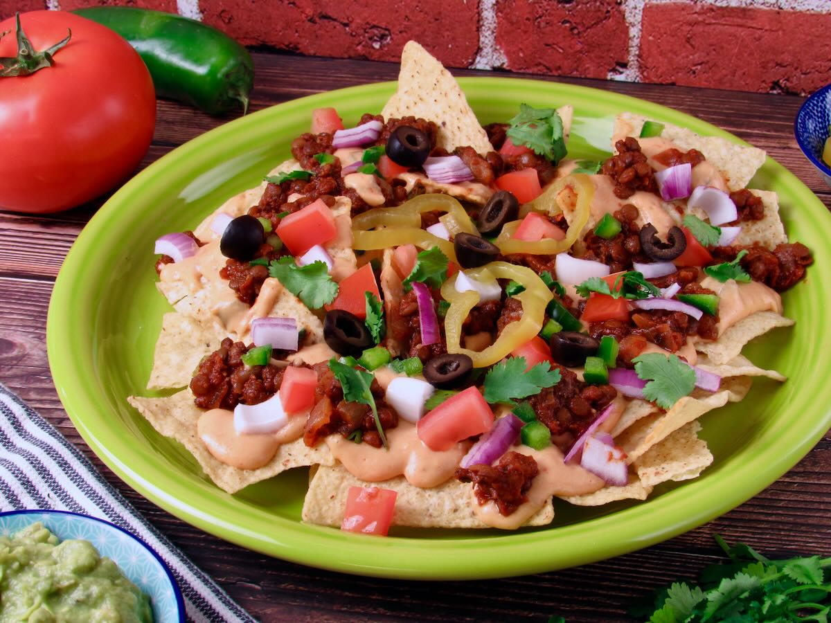 Vegan Nachos with Cashew Queso and toppings.