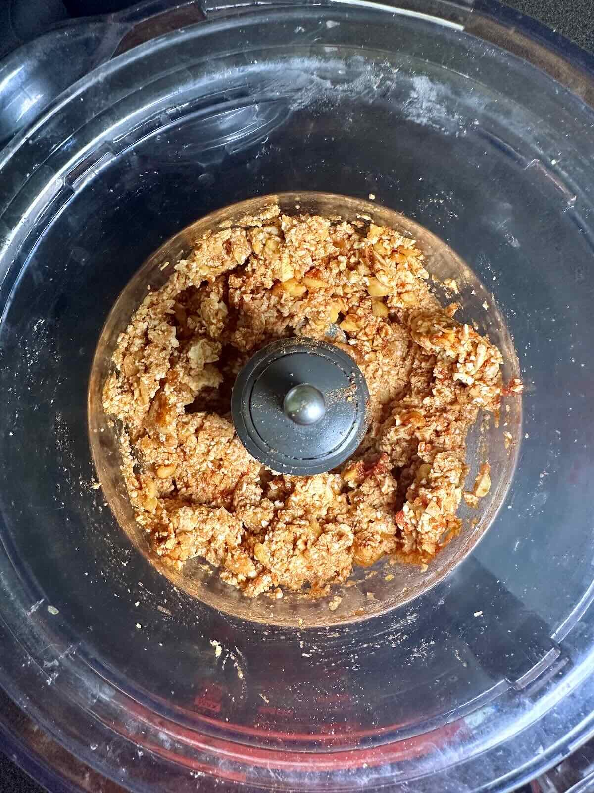 Tofu and chickpeas in a food processor to make Chickpea Veggie Burgers. 