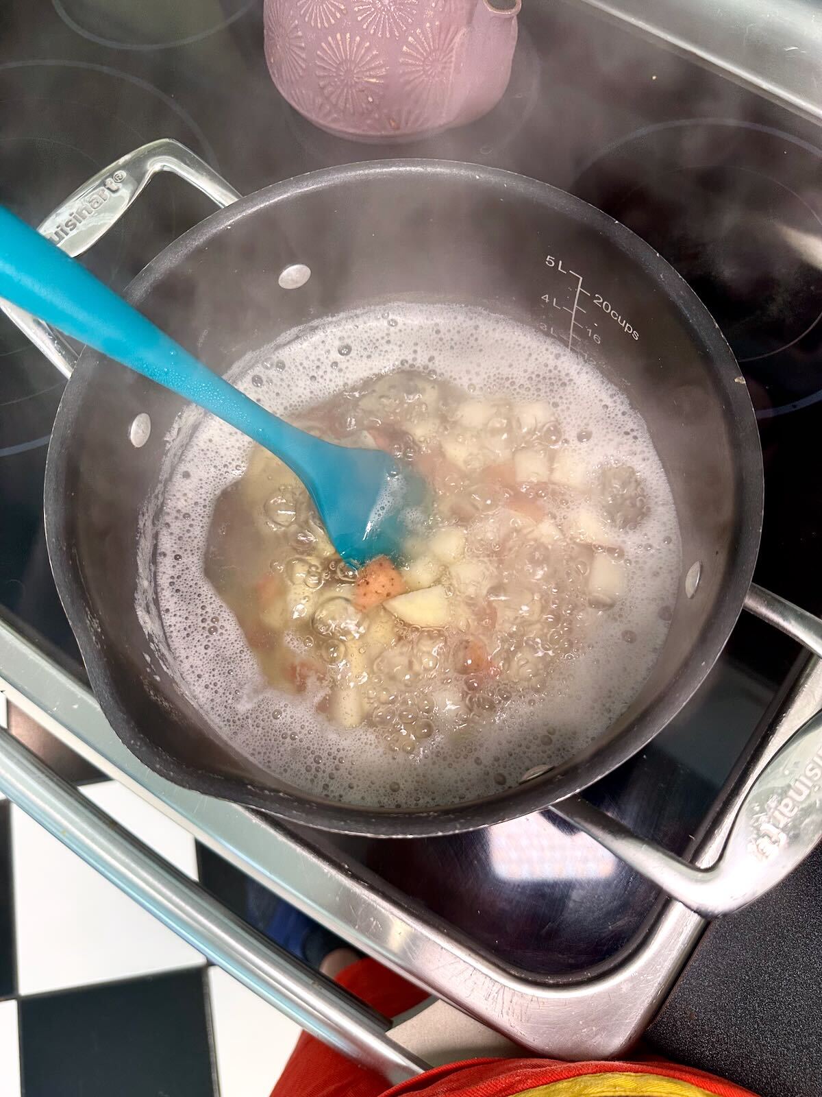 Red potatoes boiling in a pot for Vegan Potato Salad.