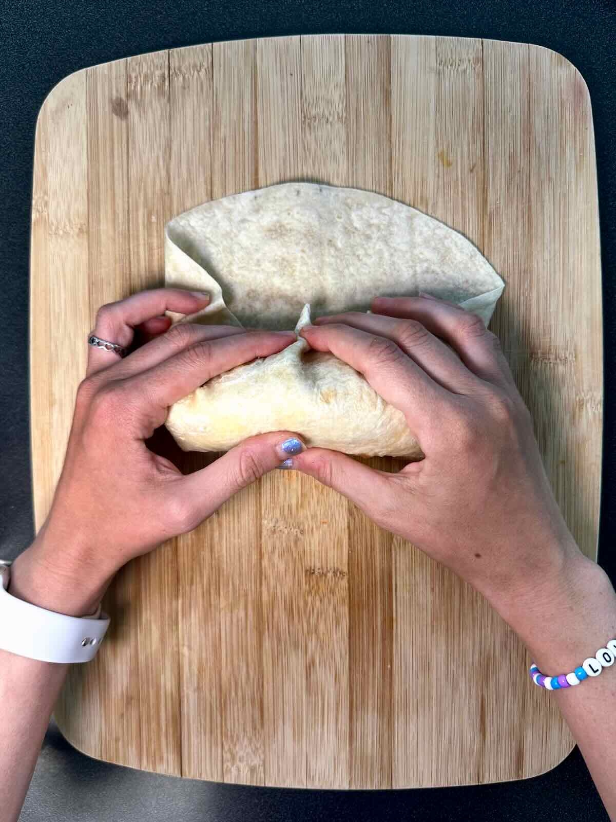 Rolling up a Tex Mex Breakfast Burrito.