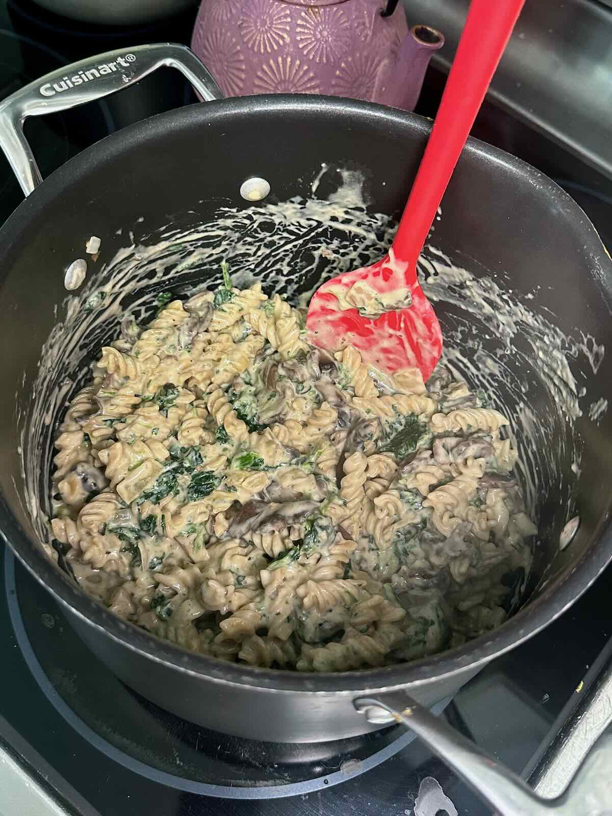 Creamy Mushroom Spinach Pasta on the stovetop.