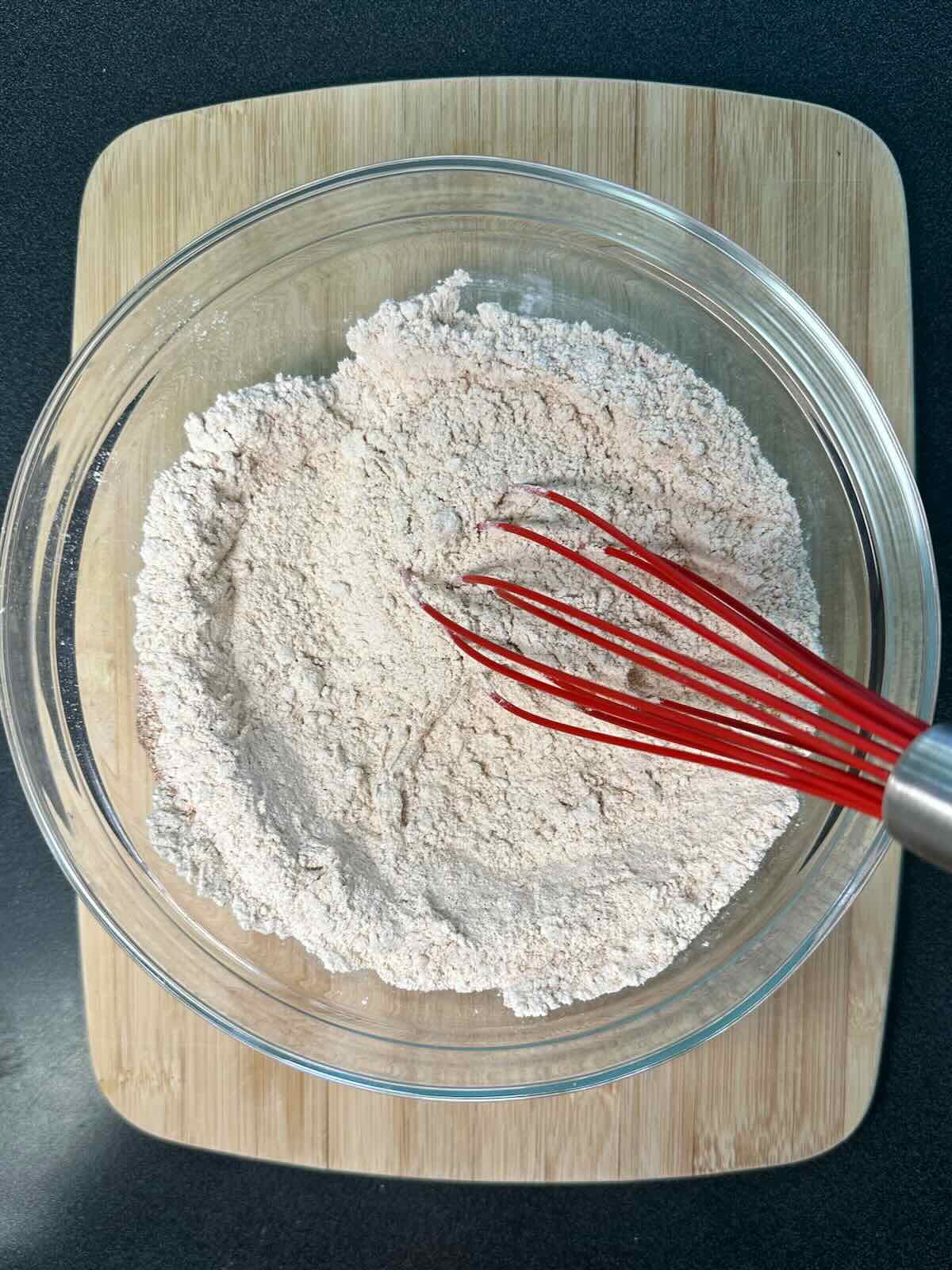 Mixing dry ingredients together for an Easy Banana Bread recipe.