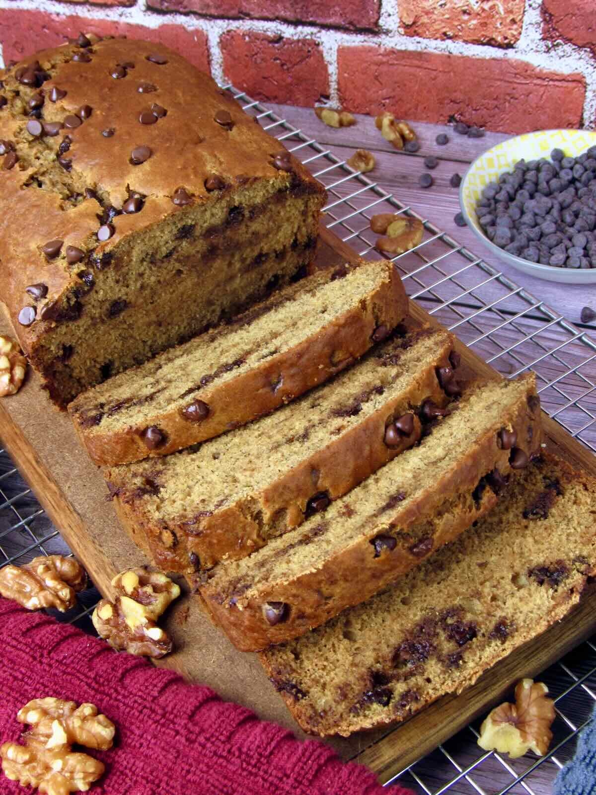 Naturally Sweetened Banana Bread, sliced and sitting on a cooling rack.