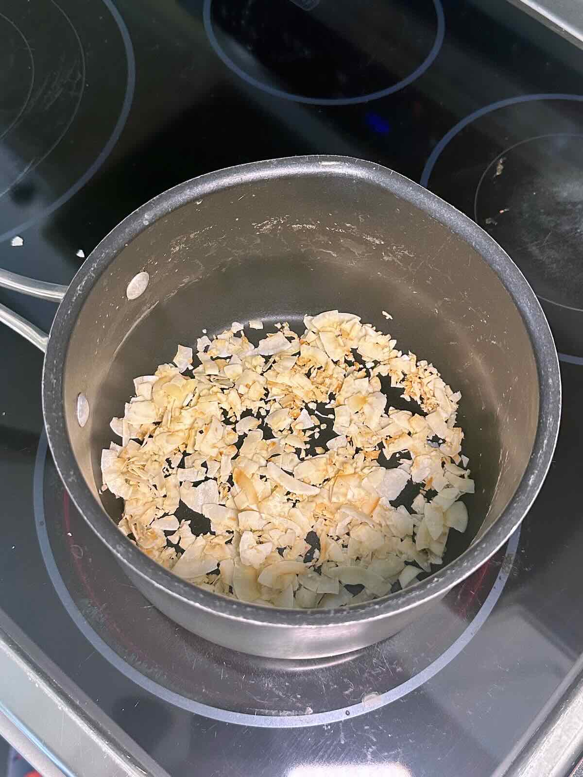 Toasted coconut flakes for homemade coconut rice.