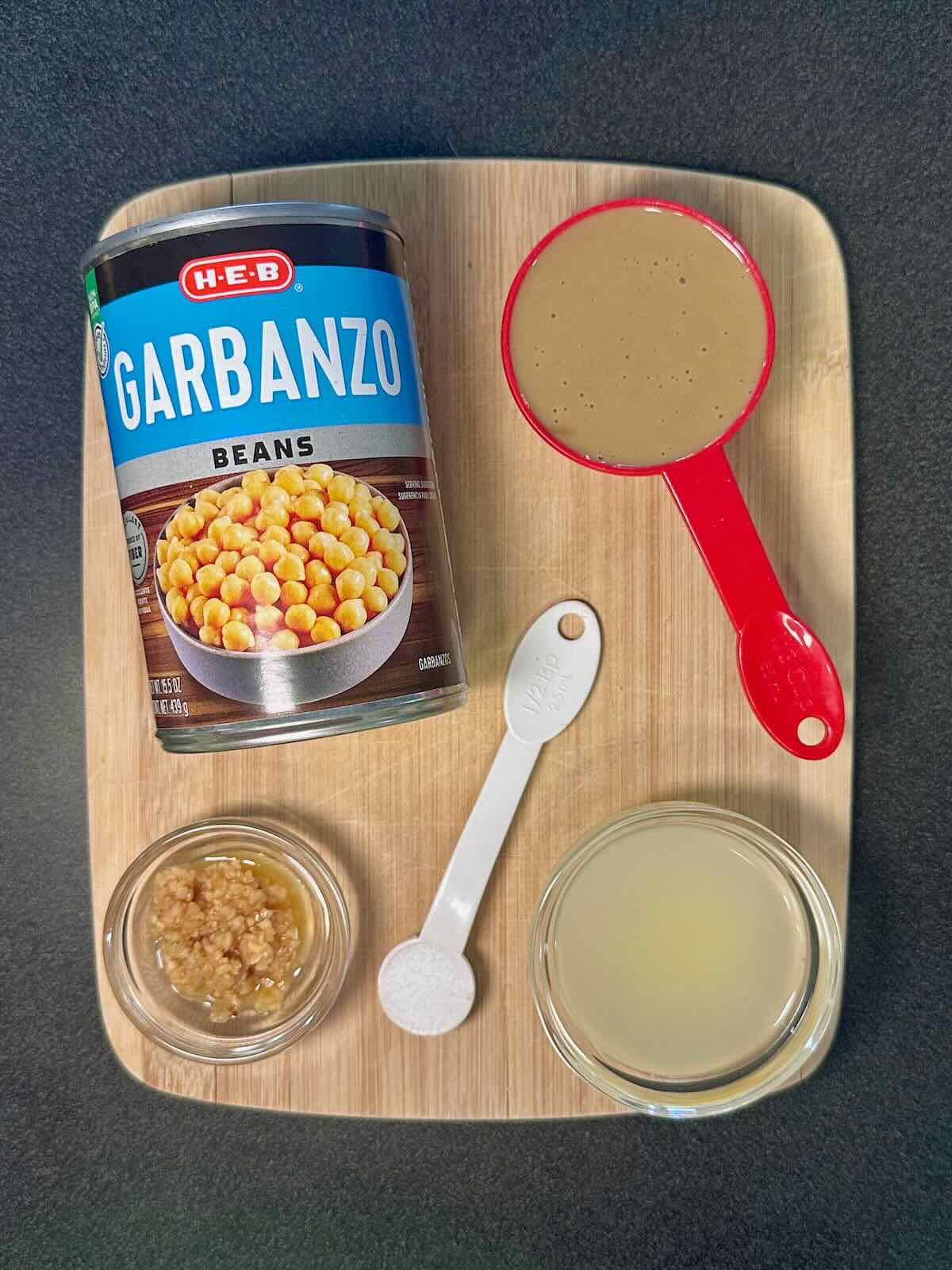 Ingredients for homemade oil-free hummus, including garbanzo beans, tahini, and garlic.