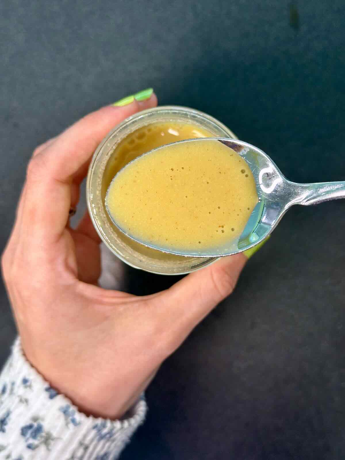 Mixing together a homemade Lemon Dijon Dressing for a fresh summer salad.