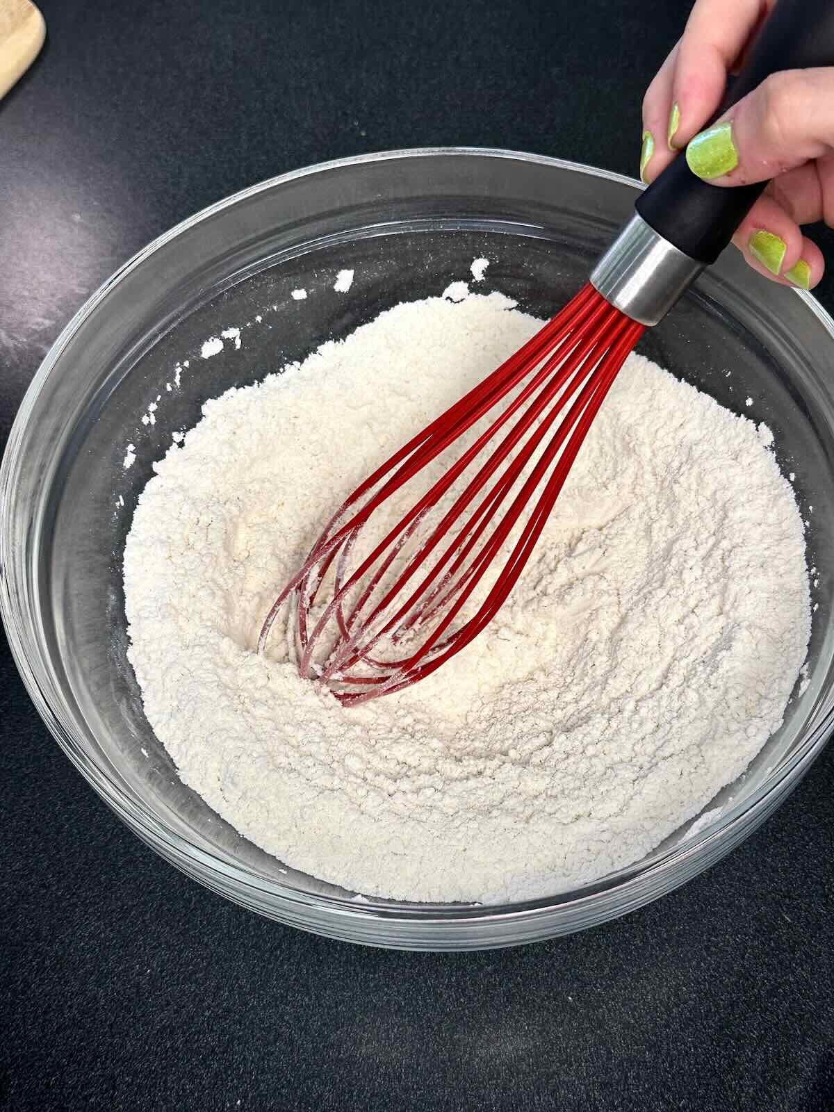 Whisking together dry ingredients for buttermilk pancakes.
