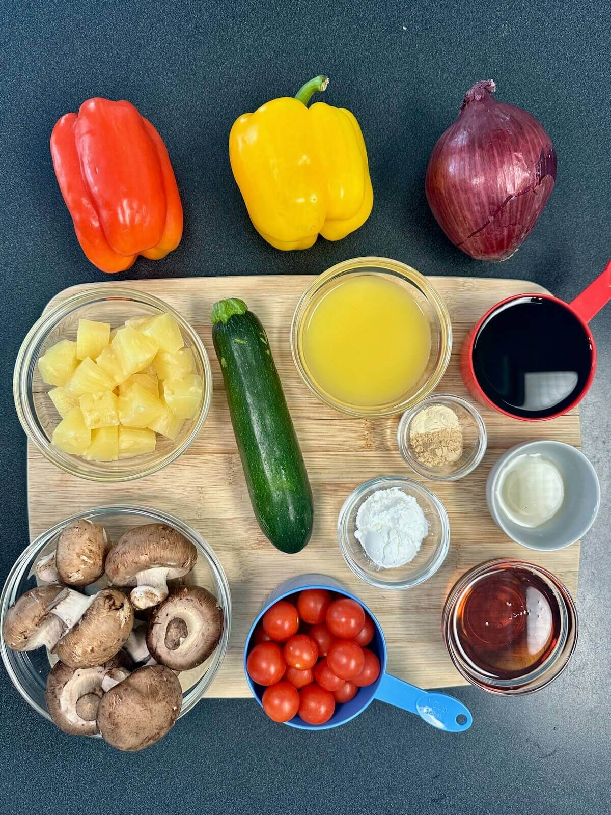 Ingredients for Teriyaki Veggie Kebabs, including fresh veggies, pineapples, orange juice, and tamari.