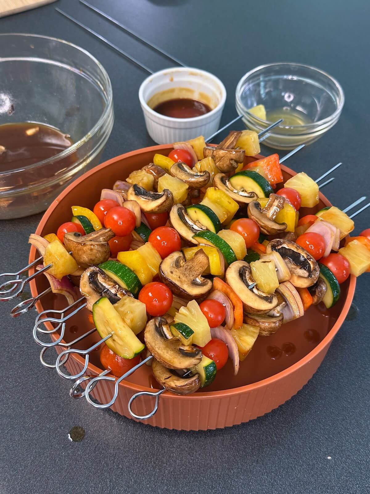 Assembled veggie skewers, ready to be grilled.