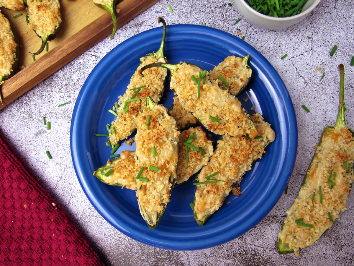 Overhead view of non-dairy jalapeño poppers, served on an appetizer plate.