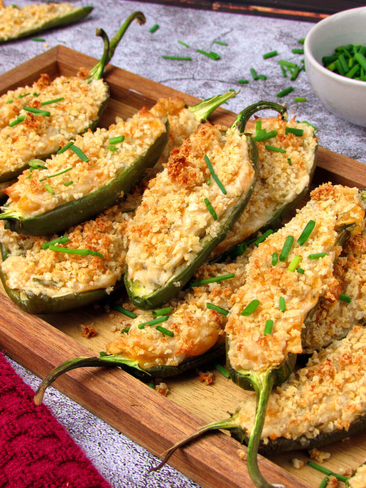 Close up of baked jalapeño poppers on a serving tray.