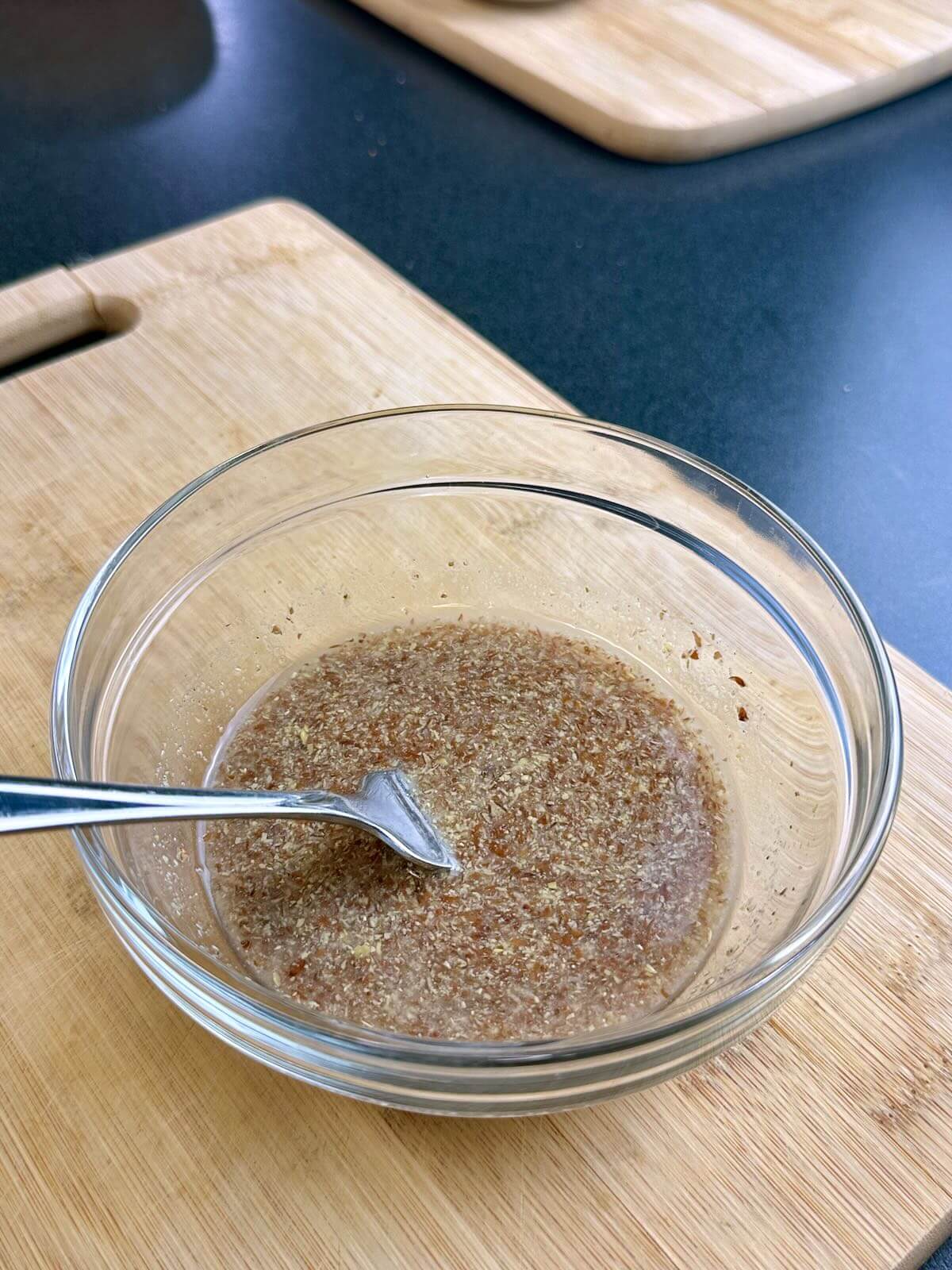Making a vegan flax egg out of ground flaxseed and cold water.